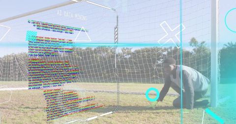 Goalkeeper kneeling with ai data mining overlay on soccer goal for sports technology