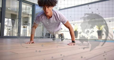 Performing plank exercise on urban terrace wearing fitness watch with holographic data overlay