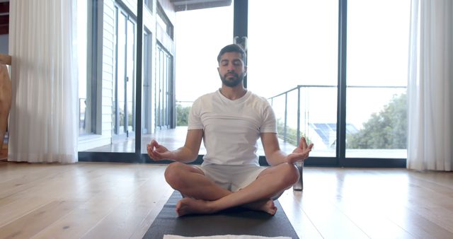 Serene Man Meditating in Peaceful Home Setting - Download Free Stock Images Pikwizard.com