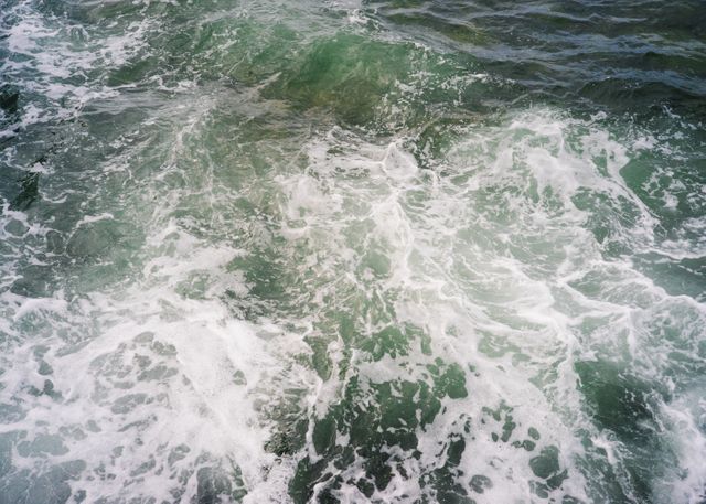 Waves Crashing on Ocean Surface Creating White Foam - Download Free Stock Photos Pikwizard.com