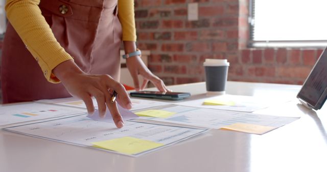 Businesswoman Analyzing Financial Documents in Office - Download Free Stock Images Pikwizard.com