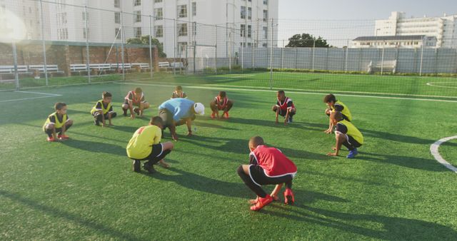 Youth Soccer Team Stretching on Outdoor Field - Download Free Stock Images Pikwizard.com