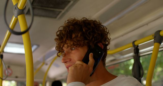 Young Man Talking on Smartphone in Public Bus - Download Free Stock Images Pikwizard.com