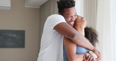 Joyful Couple Celebrating Pregnancy Together at Home