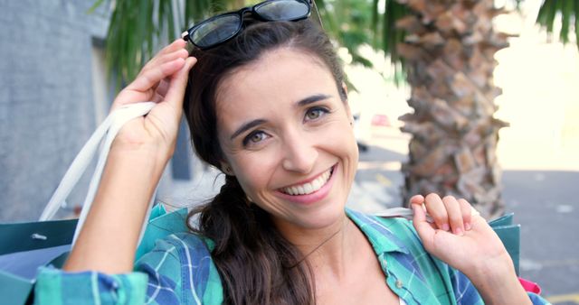 Cheerful Woman Shopping with Sunglasses and Bags Outdoors - Download Free Stock Images Pikwizard.com