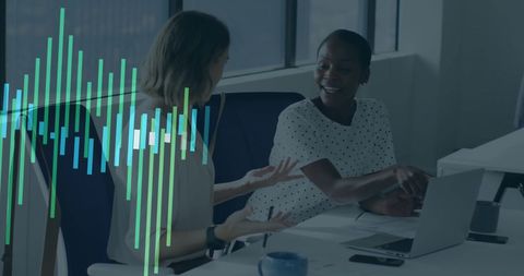 Two Professionals Analyzing Financial Data in Modern Office