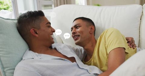 Relaxed Couple Lounging and Chatting on Comfort Sofa at Home