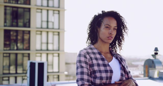 Thoughtful Young Woman Standing on Rooftop Urban Backdrop - Download Free Stock Images Pikwizard.com