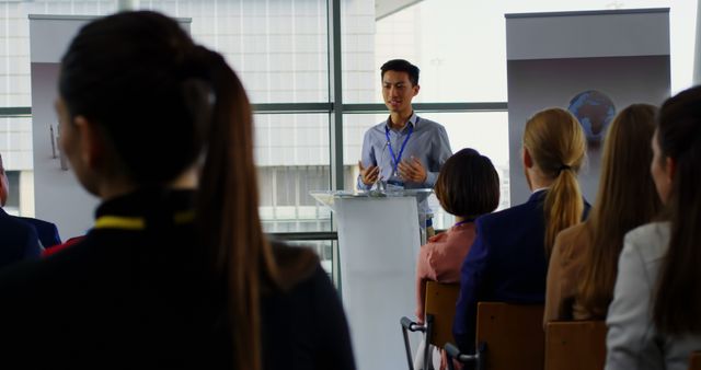 Confident Speaker Presenting at Business Seminar - Download Free Stock Images Pikwizard.com