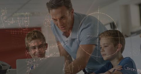 Male Teacher and Boys Collaborate Using Laptop and Math Formulas - Download Free Stock Images Pikwizard.com