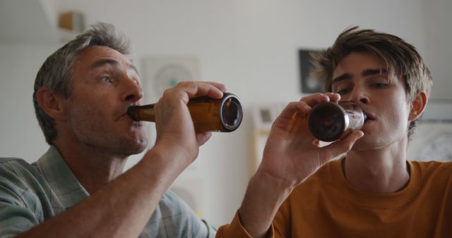 Father and Son Enjoying Beer Together at Home - Download Free Stock Images Pikwizard.com