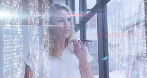 Businesswoman Using Smartphone with Data Overlay in Office