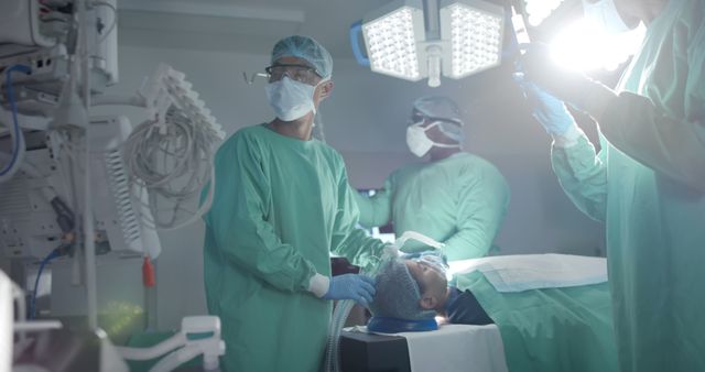 Surgeons Performing Operation with Surgical Lights - Download Free Stock Images Pikwizard.com