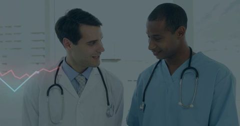 Doctors collaborating in hospital discussing patient care with teamwork and professionalism