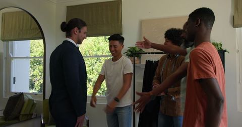 Groom Laughing with Friends Before Wedding Ceremony