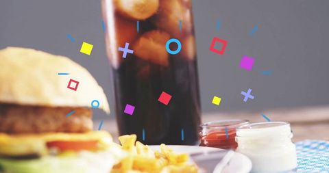 Delicious Classic Burger with Refreshing Soda and Condiments