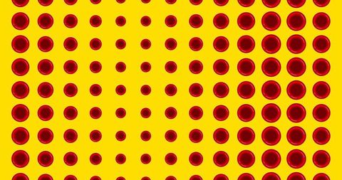 Red blood cells on vibrant yellow background imagery