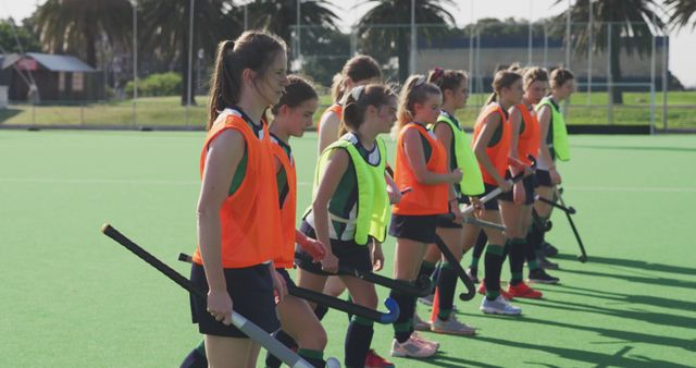 Girls Field Hockey Team Practicing on Outdoor Field - Download Free Stock Images Pikwizard.com