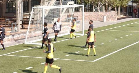 Soccer Team Warming Up Before Competitive Match on Field
