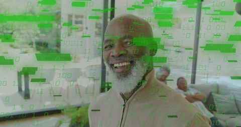 Senior Man in Modern Living Room with Digital Binary Overlay