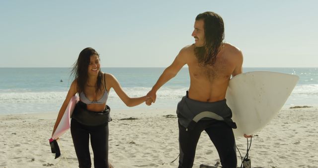 Couple Having Fun Surfing on Beach - Download Free Stock Images Pikwizard.com