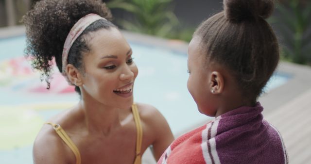 Mother Interacting with Daughter by Swimming Pool on Sunny Day - Download Free Stock Images Pikwizard.com