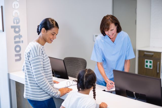 Nurse engaging with a patient and her child at the hospital reception desk. Ideal for illustrating healthcare services, patient care, hospital environments, and medical assistance. Useful for healthcare websites, brochures, and educational materials.