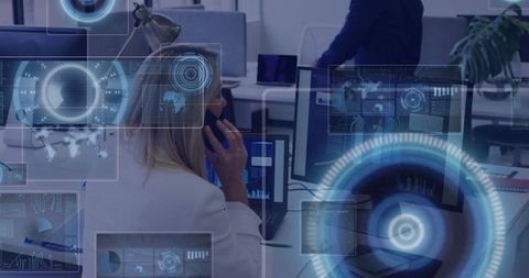 Woman Analyzing Digital Interfaces in Modern Office Setting