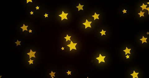 Glowing Golden Stars in Dynamic Motion on Black Background - Download Free Stock Images Pikwizard.com