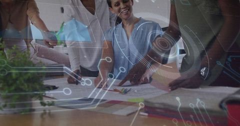 Innovative Team Collaborating on Design Project with Technology Overlay