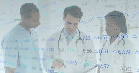 Healthcare professionals analyzing data with digital device