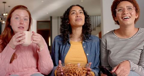 Diverse Female Friends Relaxing Together with Snacks and Drinks