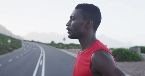Determined Athlete Resting After Mountain Road Run