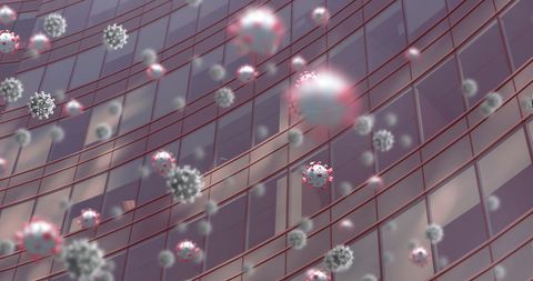 Floating coronavirus particles over city building reflect virus spread