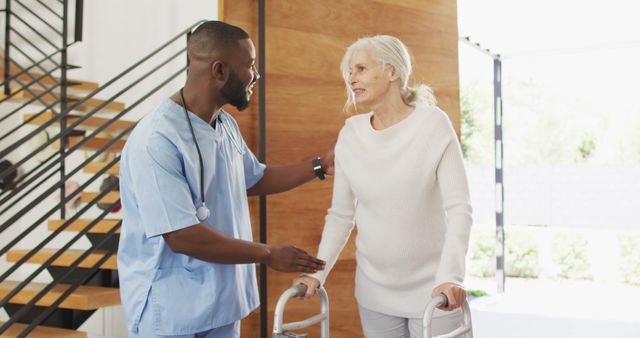 Image of happy african american male doctor taking care of caucasian senior woman - Download Free Stock Photos Pikwizard.com