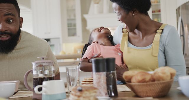 Happy Family Having Breakfast Together in Kitchen - Download Free Stock Images Pikwizard.com