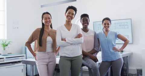 Confident Businesswomen Team Standing Together in Modern Office