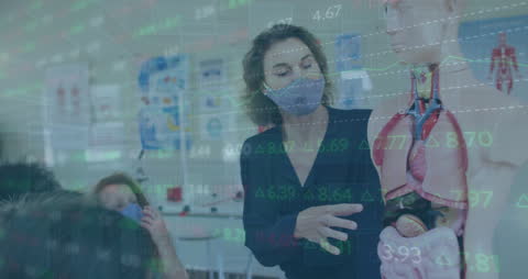 Teacher Illustrating Human Anatomy in Data-Driven Classroom