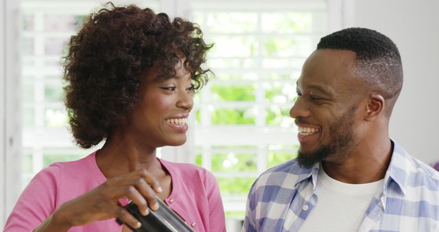 Happy Couple Smiling and Socializing in Bright Kitchen - Download Free Stock Images Pikwizard.com