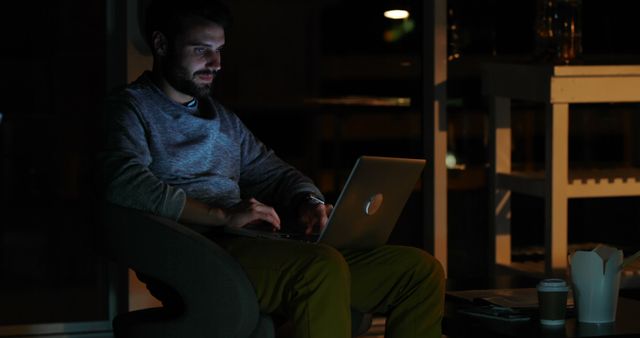 Man working on laptop in dark room at night - Download Free Stock Images Pikwizard.com