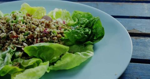 Healthy Grain Salad with Lentils on Fresh Lettuce