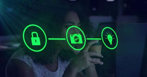 Woman using smartphone activating privacy hud with lock, camera and idea icons in coworking