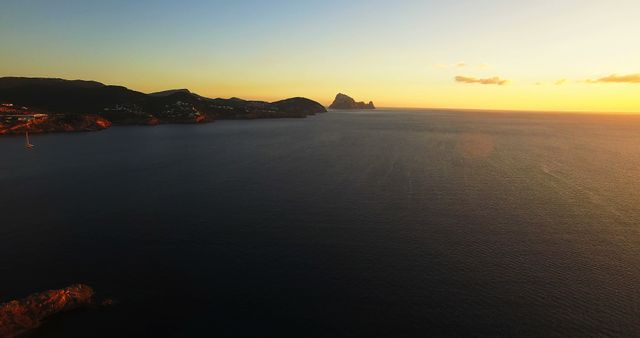 Serene Ocean Sunset with Distant Island Horizon - Download Free Stock Photos Pikwizard.com