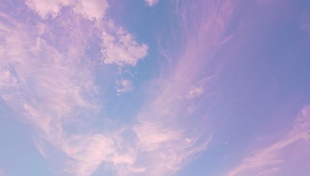 Dreamy Skyscape with Pink and Lavender Cirrus Clouds