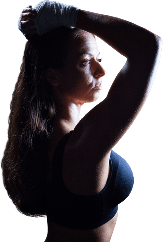 Focused Female Athlete Adjusting Hair Preparing for Training Session Transparent