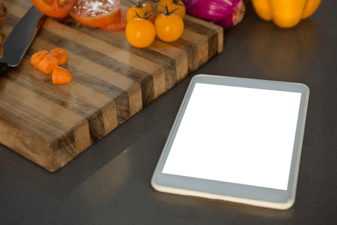 transparent tablet on kitchen counter with fresh vegetables - Download Free Stock Videos Pikwizard.com