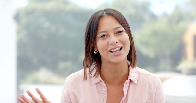 Smiling Woman in Casual Shirt Enjoying Outdoor Conversation - Download Free Stock Images Pikwizard.com