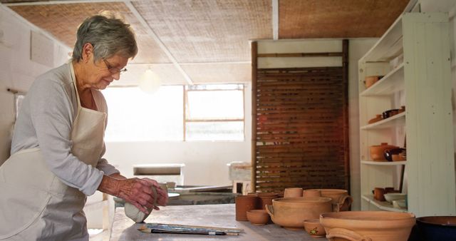 Senior Woman Working with Clay in Pottery Studio - Download Free Stock Images Pikwizard.com