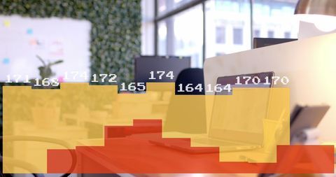 Analyzing Data Visualization on Laptop in Modern Office