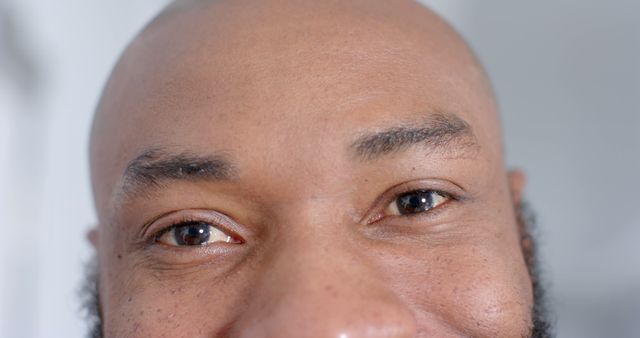 Close-Up of Smiling Man's Eyes and Forehead - Download Free Stock Images Pikwizard.com